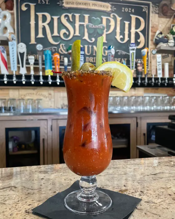 Irish Goodbye Bloody Mary at the bar under the Irish Pub sign