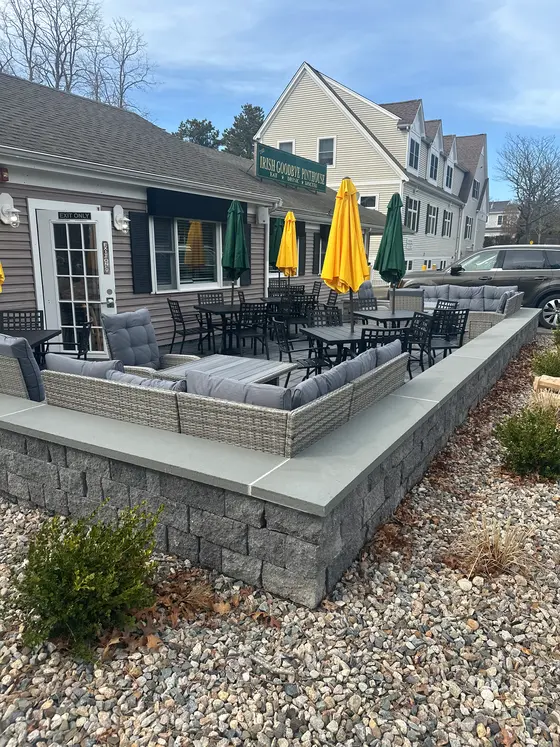 The outdoor patio with seating and umbrellas